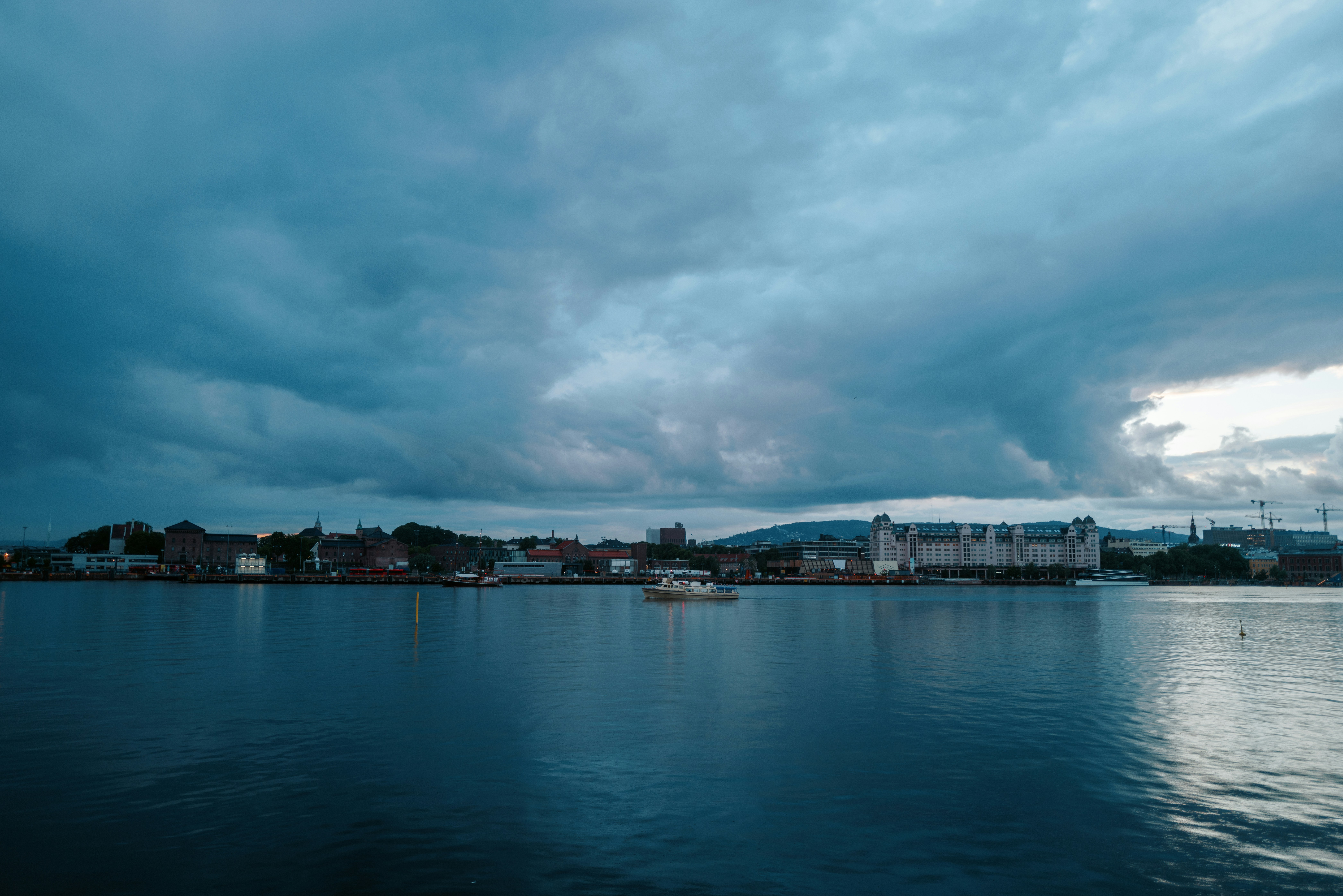 a large body of water under a cloudy sky