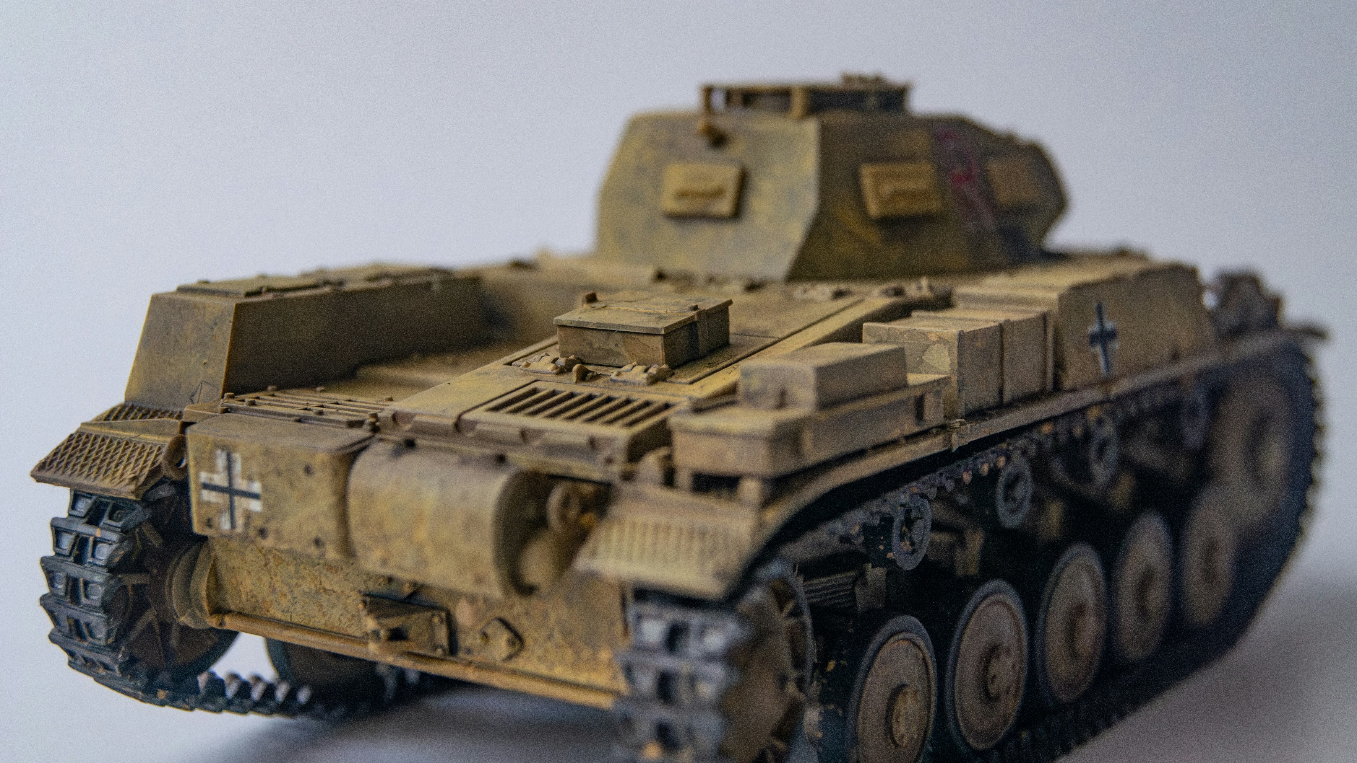 a close up of a toy tank on a table