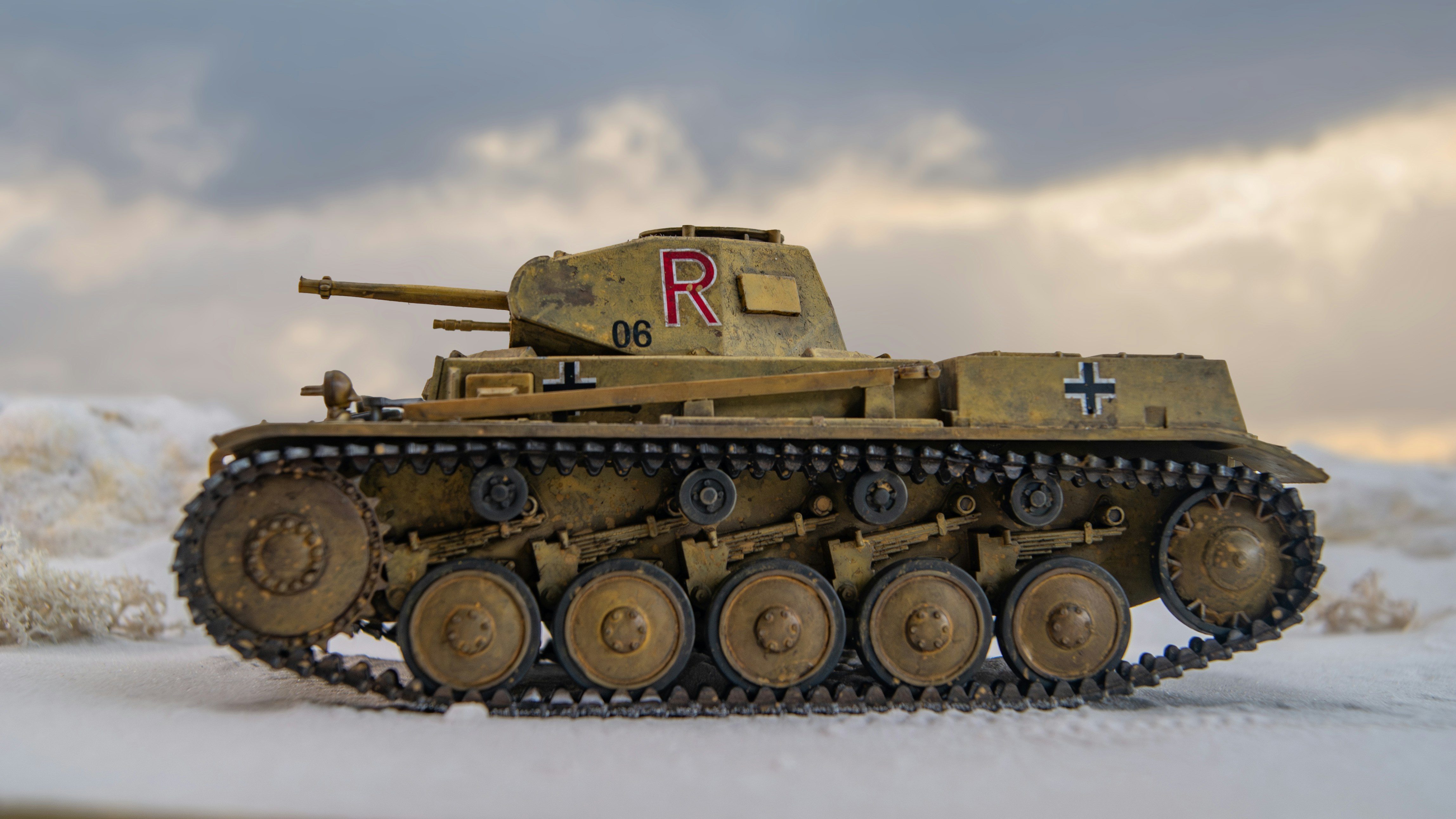 a toy tank with a cross painted on it
