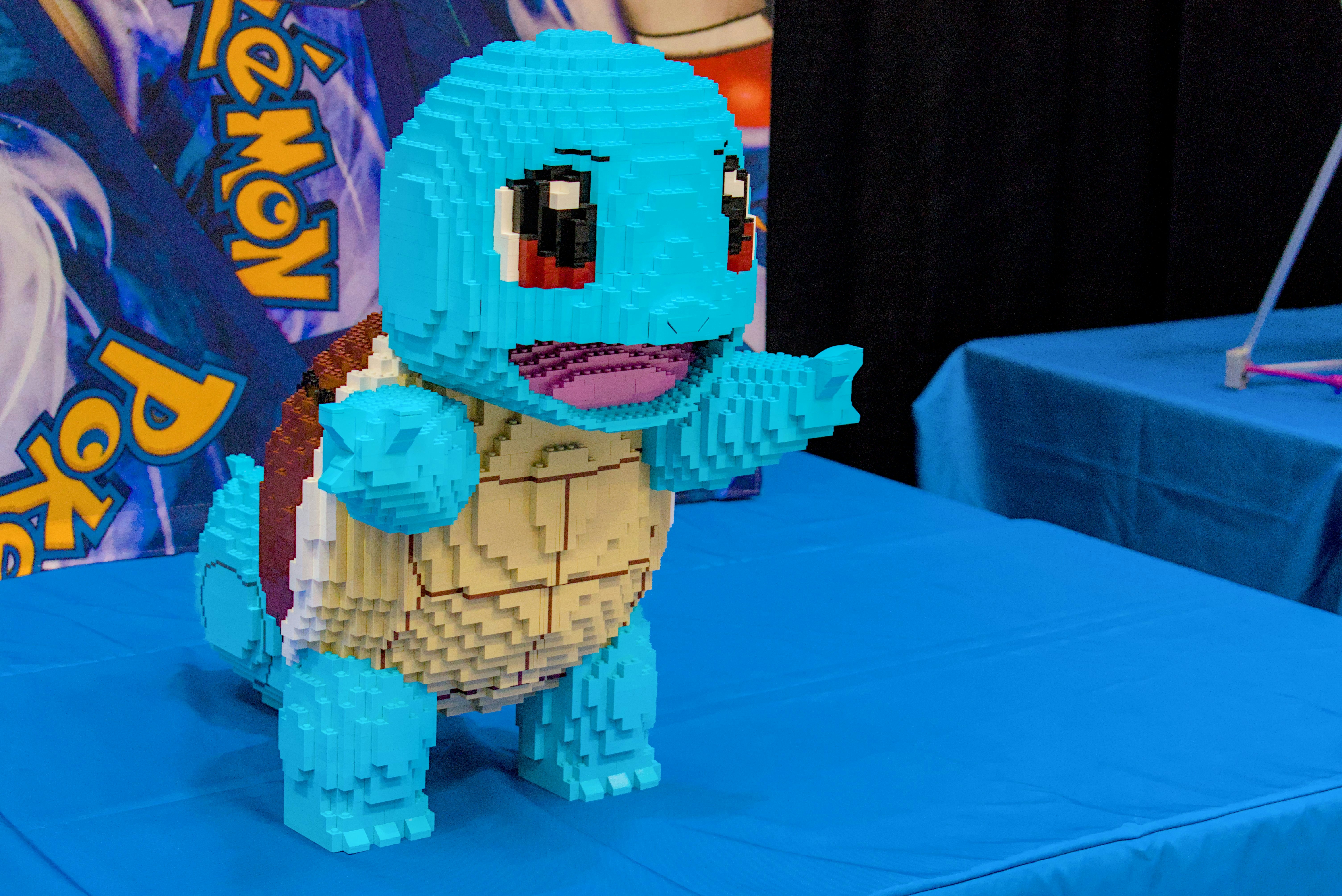 a lego model of a blue dinosaur on a table