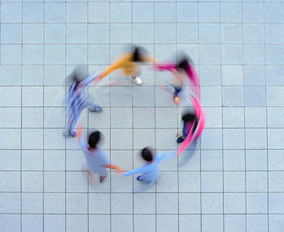 A group of people standing in a circle