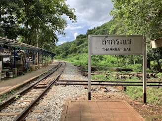 a sign that is on the side of a train track