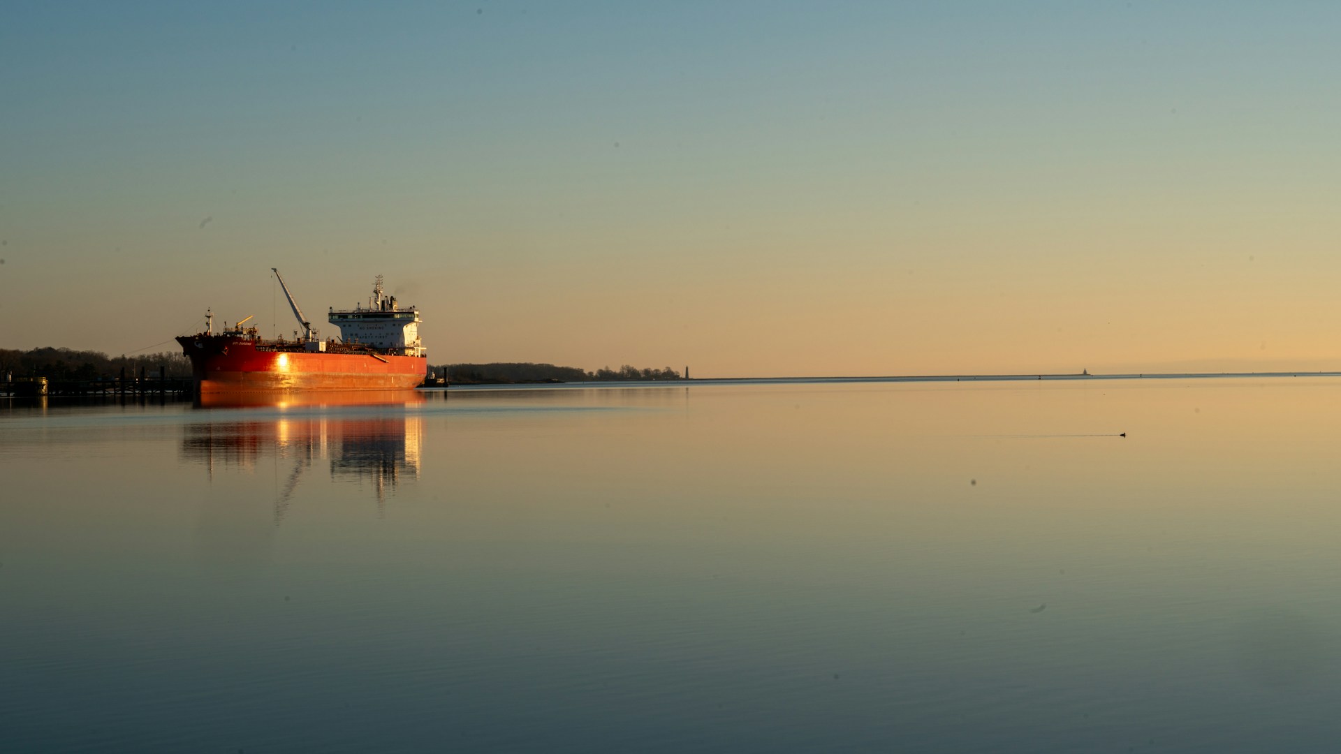 a large boat floating on top of a large body of water