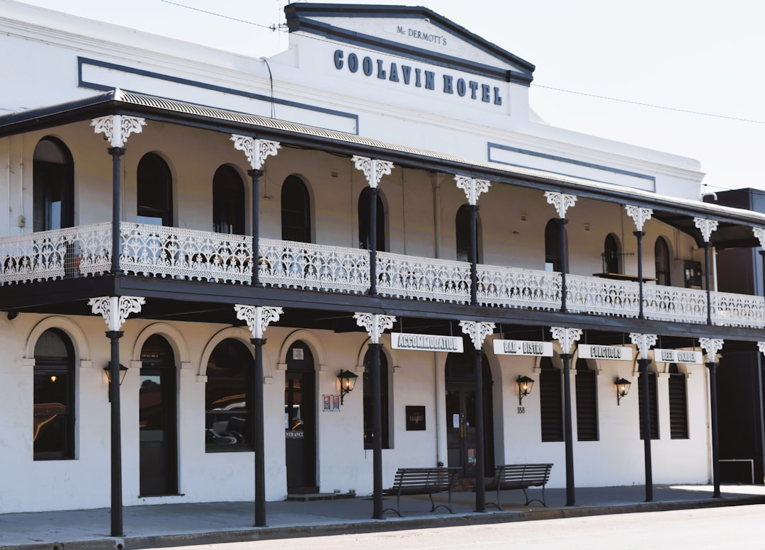 a white building with balconies and a balcony,