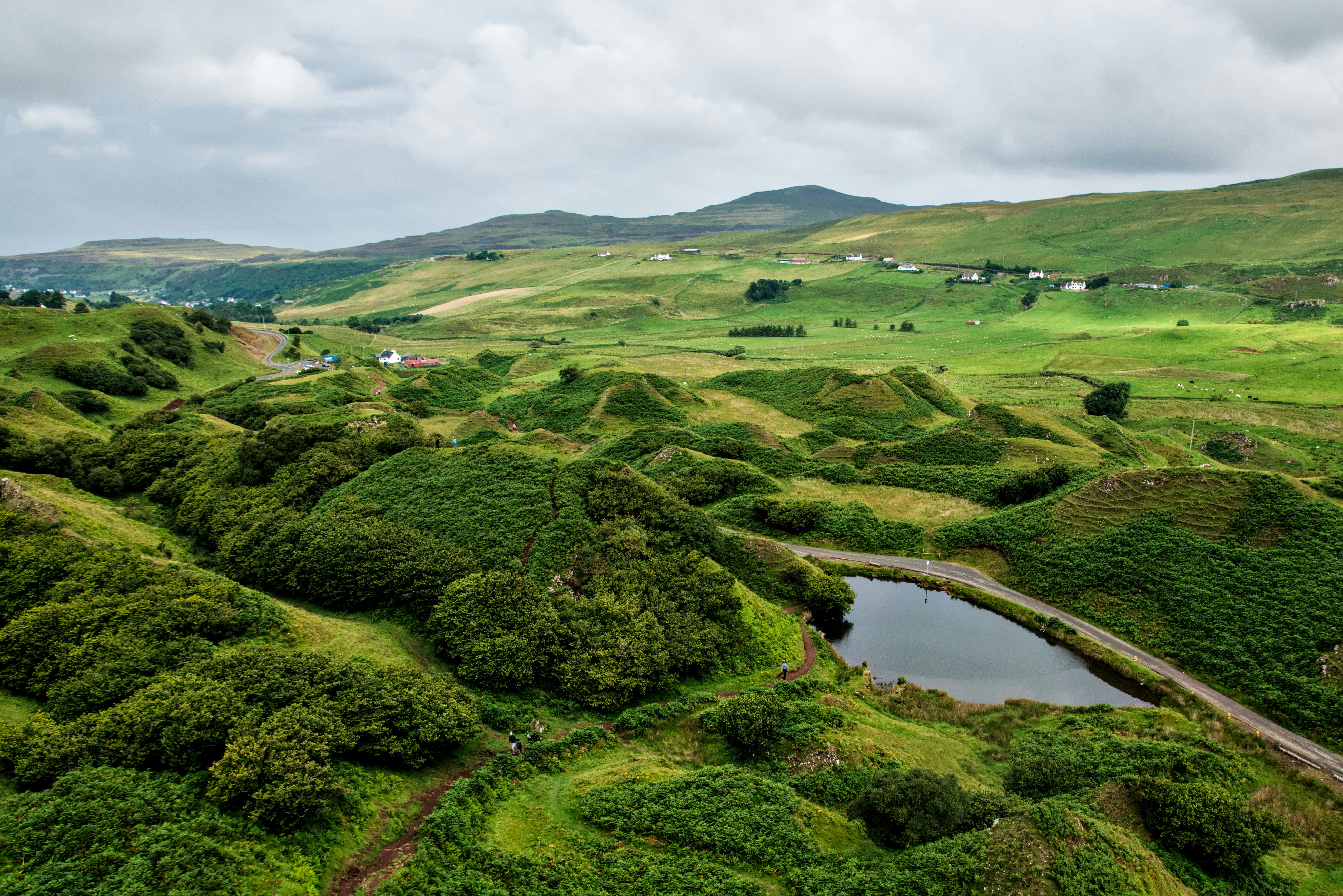 an aerial view of a lush green valley