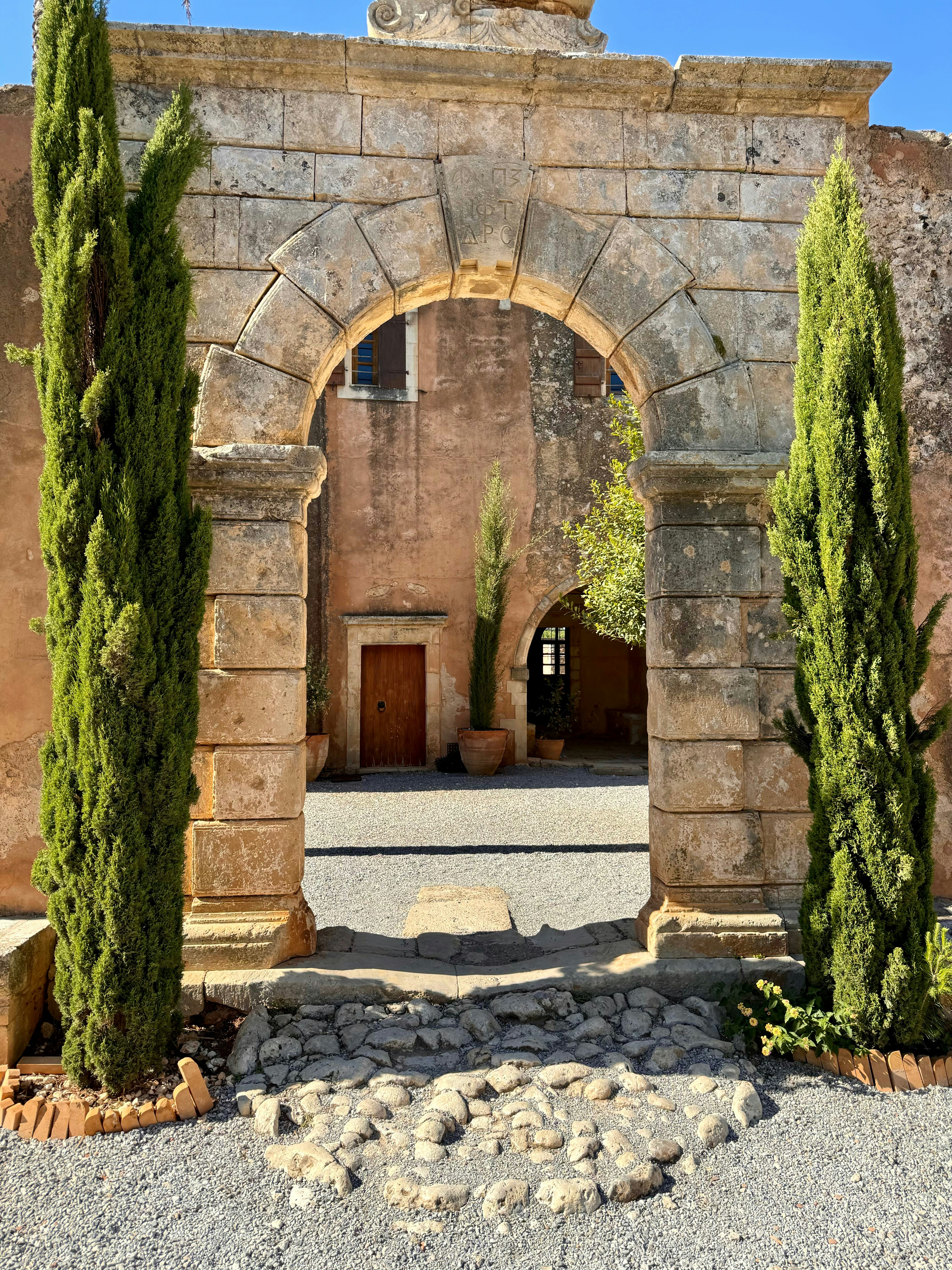 A stone building with a clock on top of it