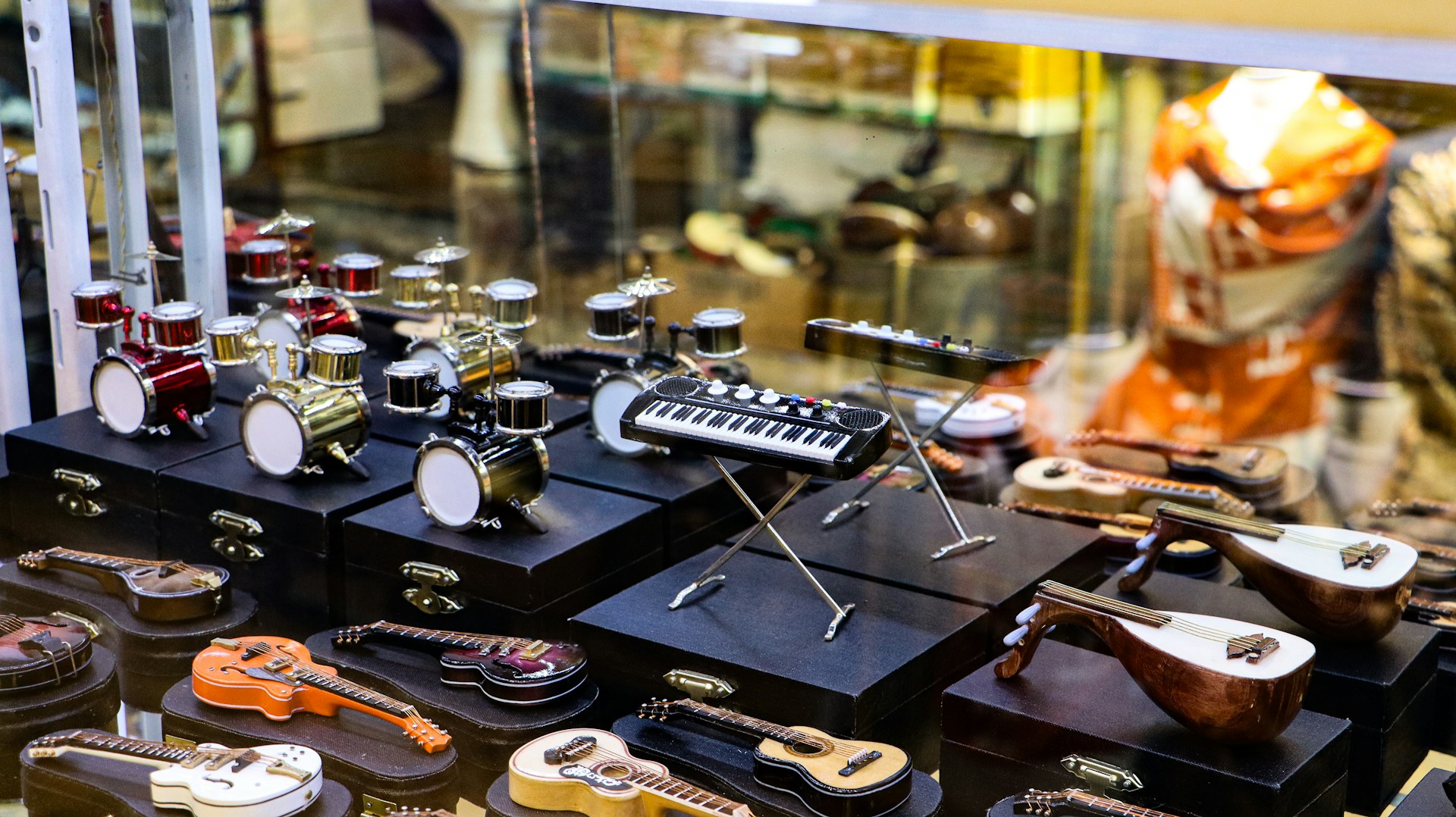 A display case filled with lots of musical instruments