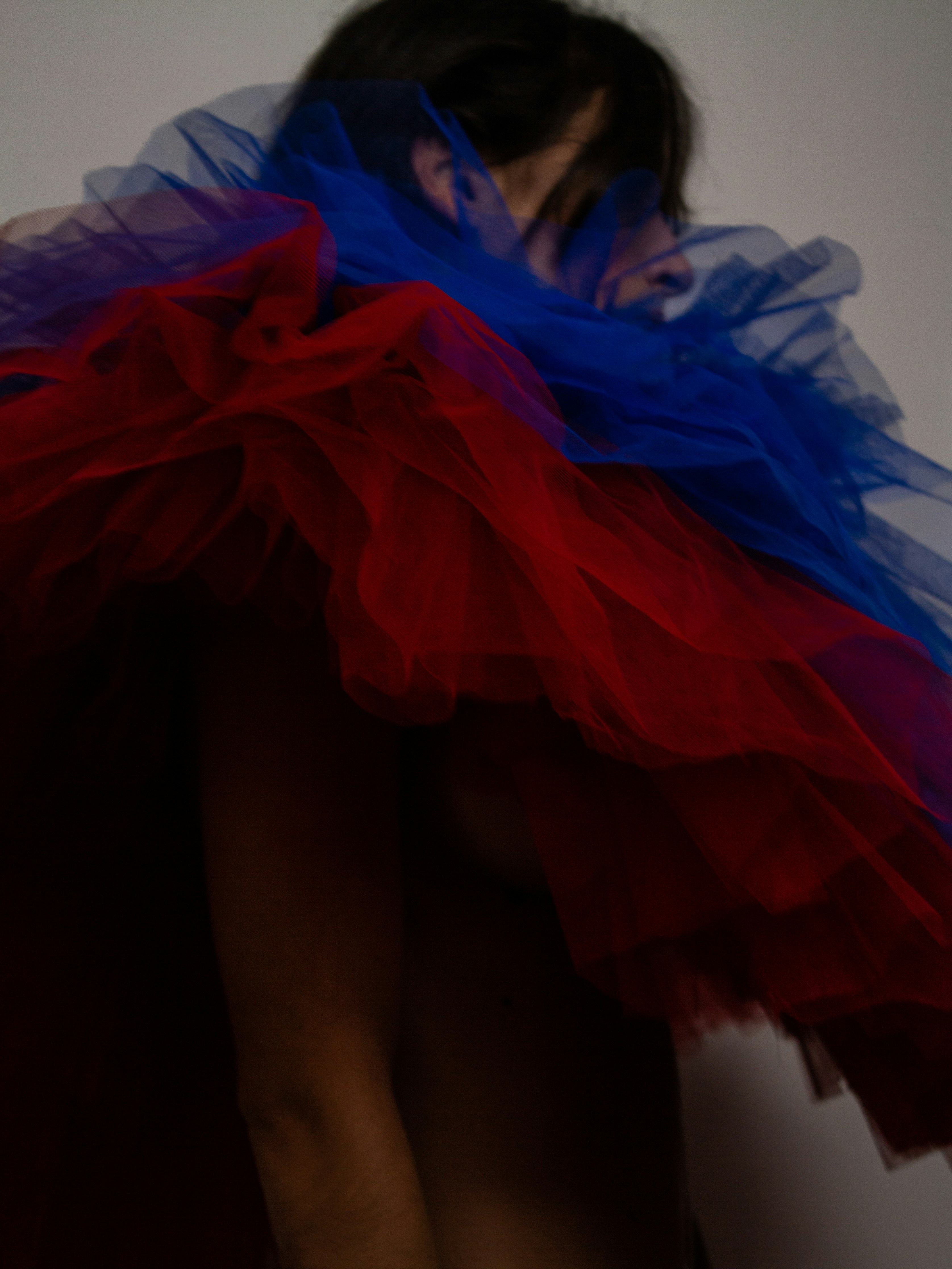 a woman in a red, white and blue dress