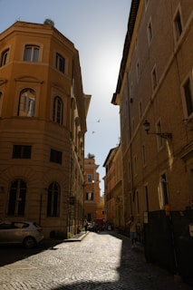 a cobblestone street lined with tall buildings