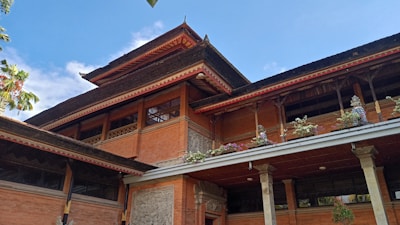 a large brown building with a lot of windows