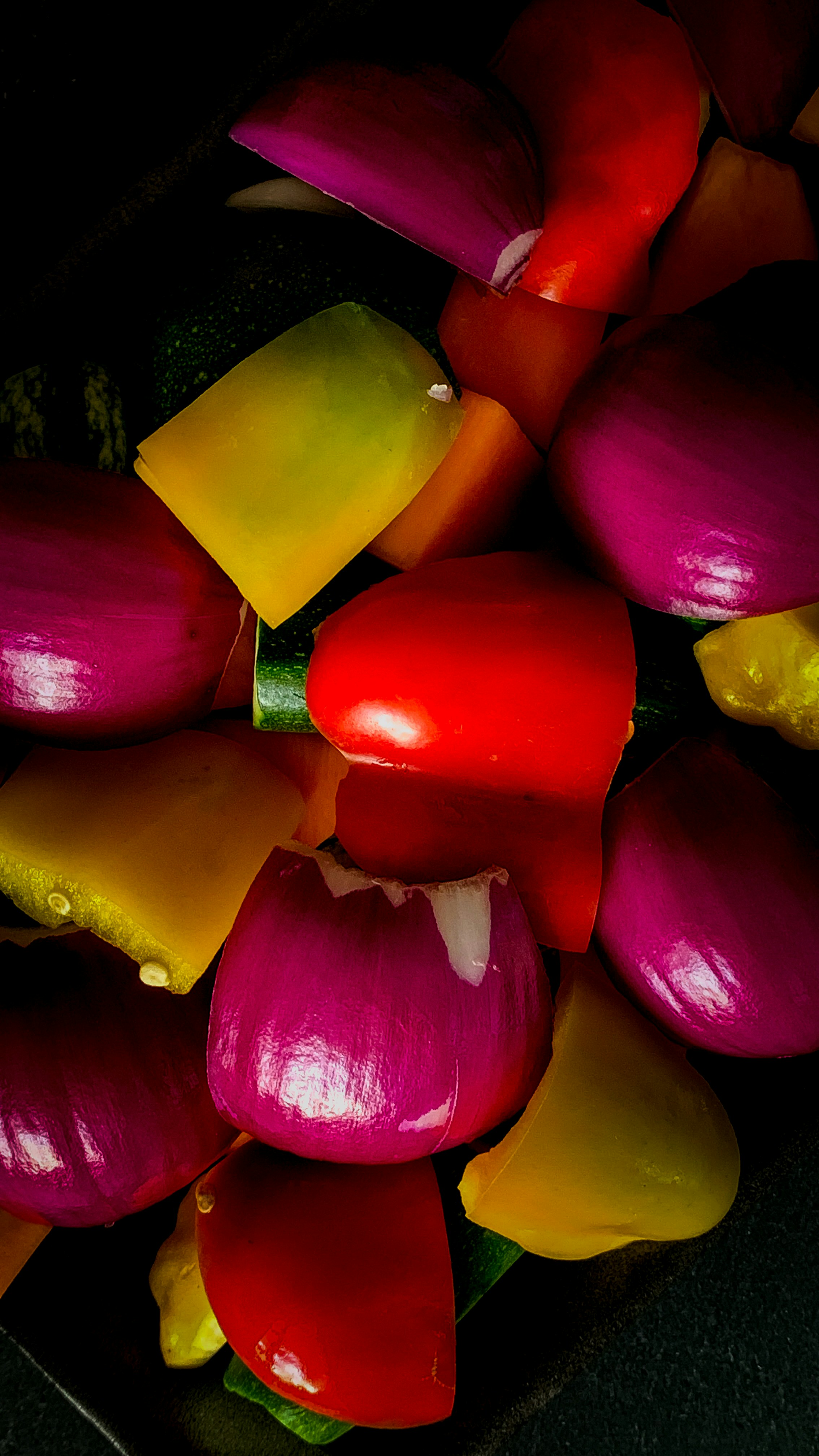 a pile of colorful vegetables sitting on top of a table