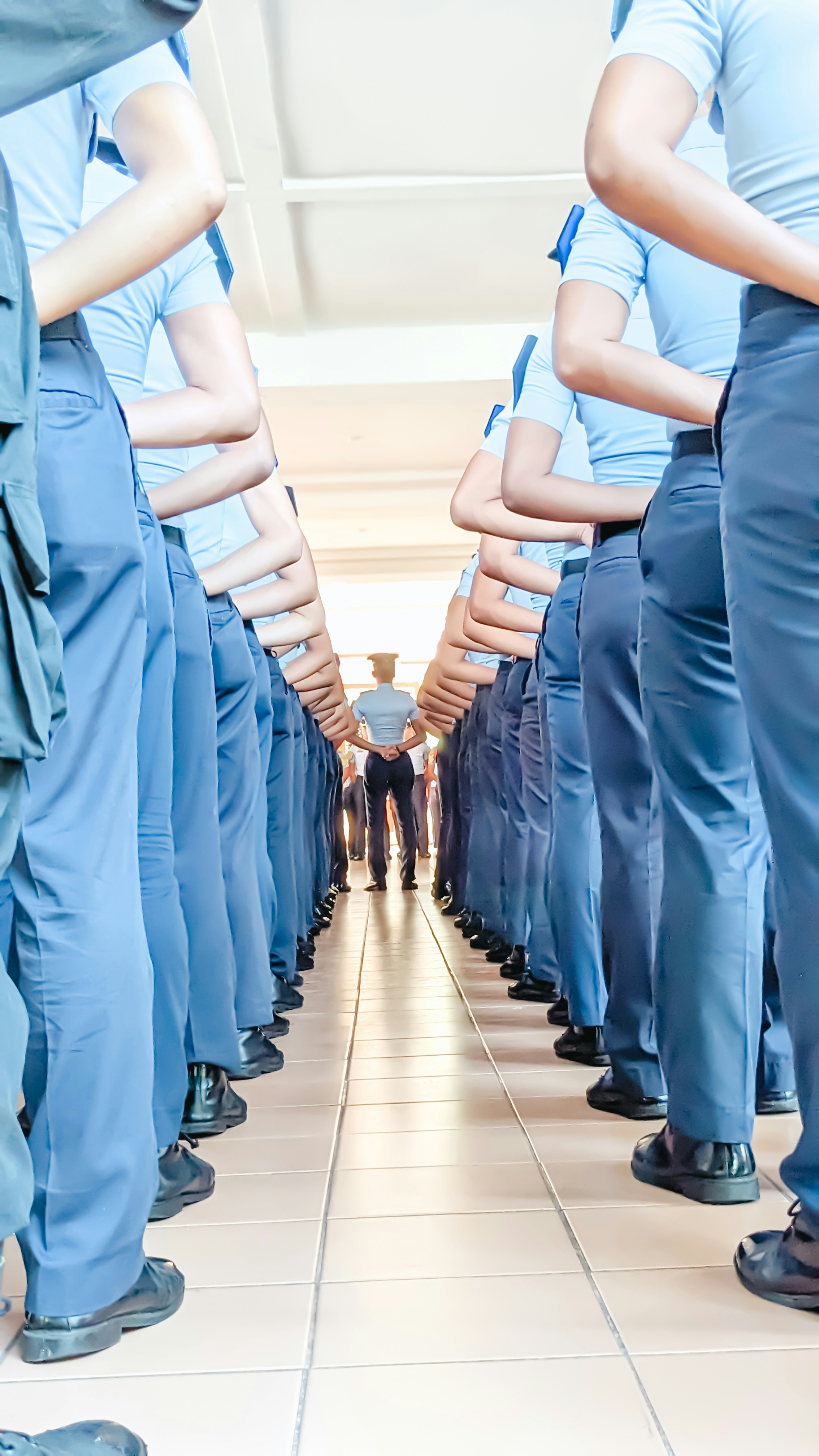 a group of men in blue uniforms standing in a line
