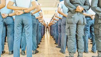 a group of uniformed men standing next to each other