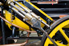 a close up of a yellow and black machine