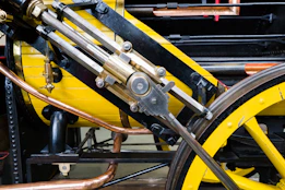 a close up of a yellow and black machine