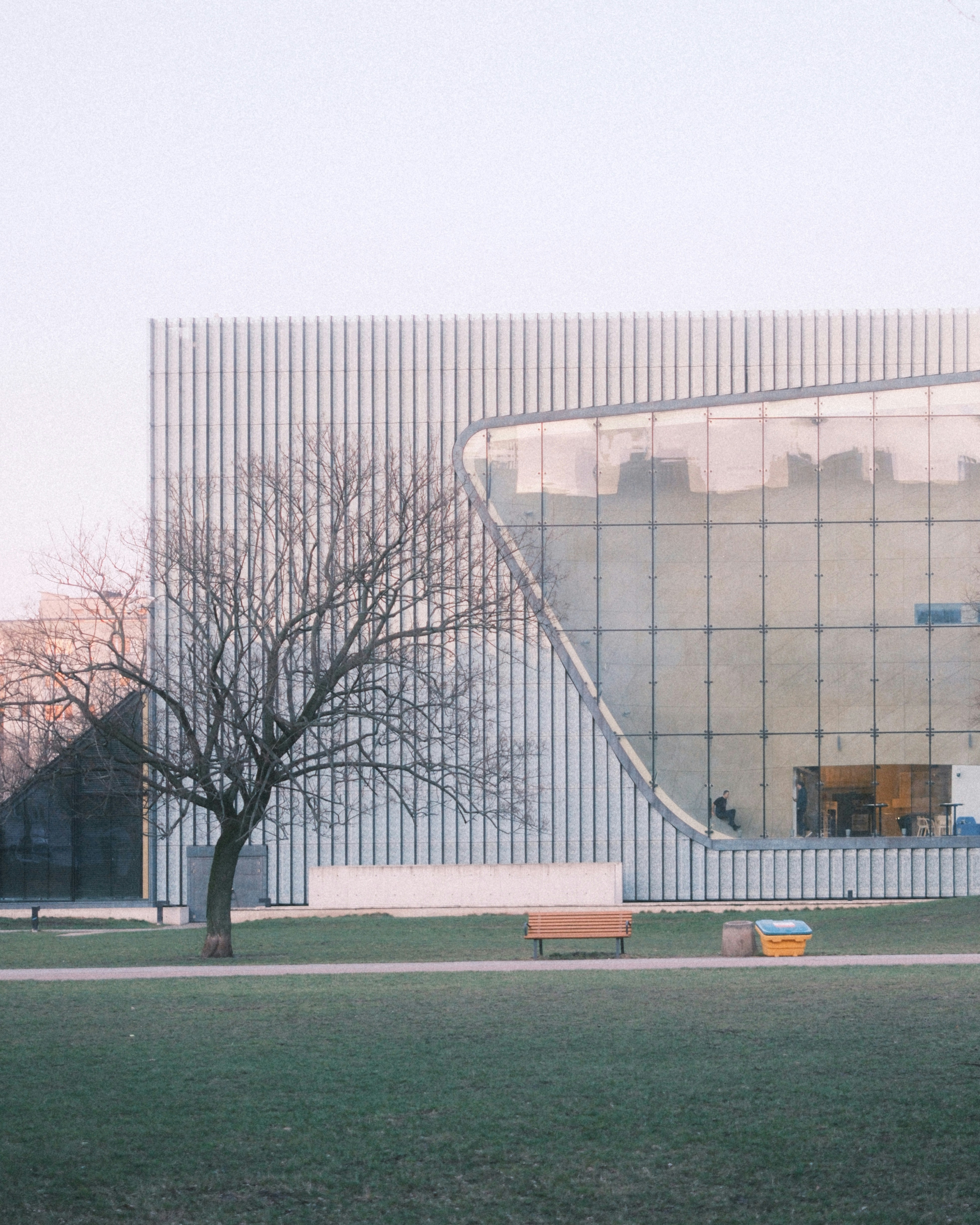 a large building with a tree in front of it