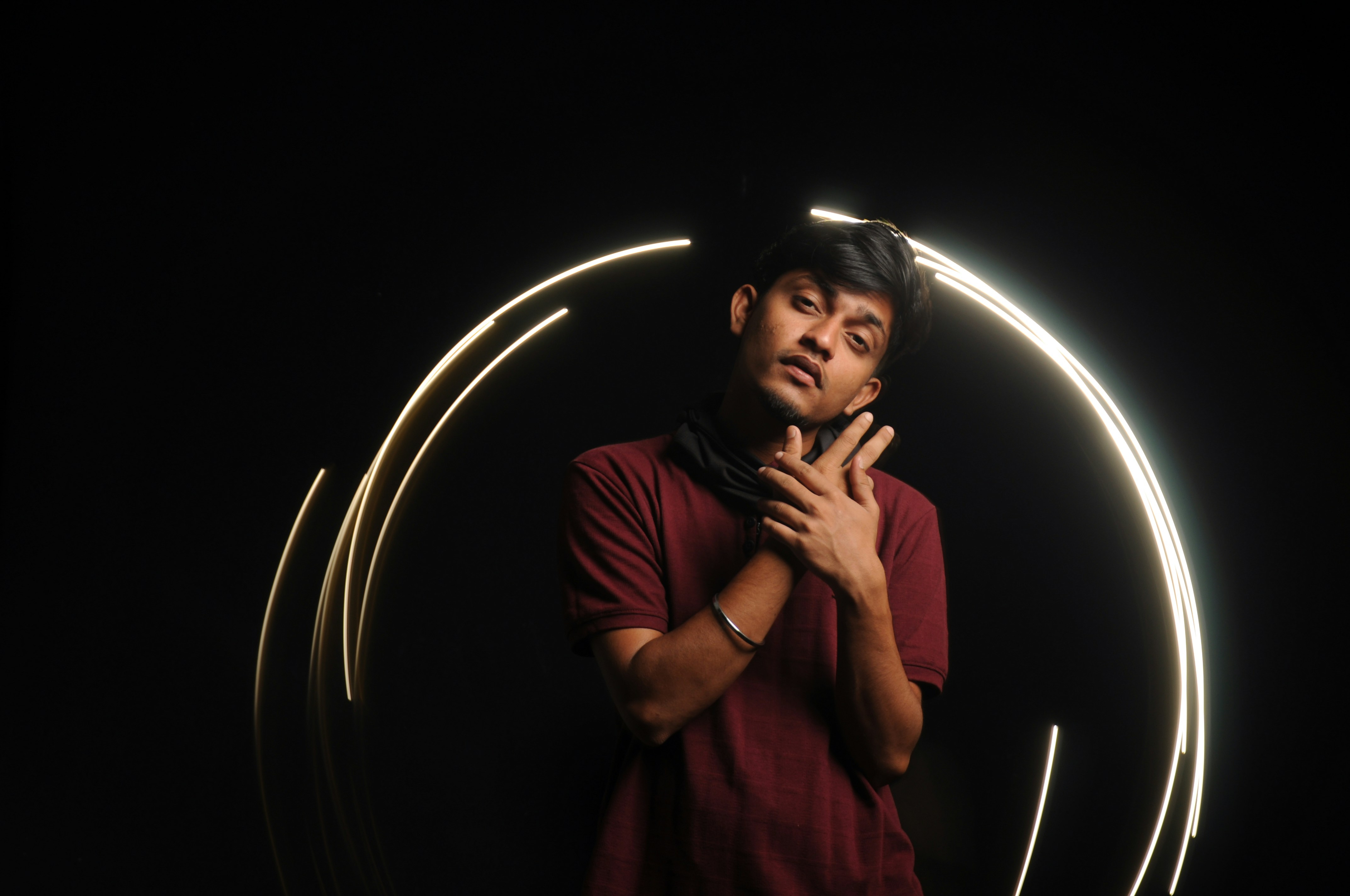 a man standing in front of a circular light