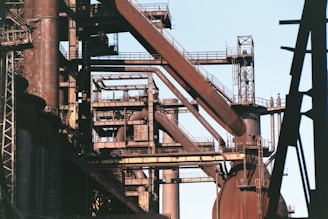 a very tall metal structure with lots of pipes