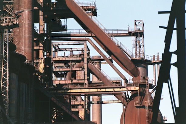 a very tall metal structure with lots of pipes