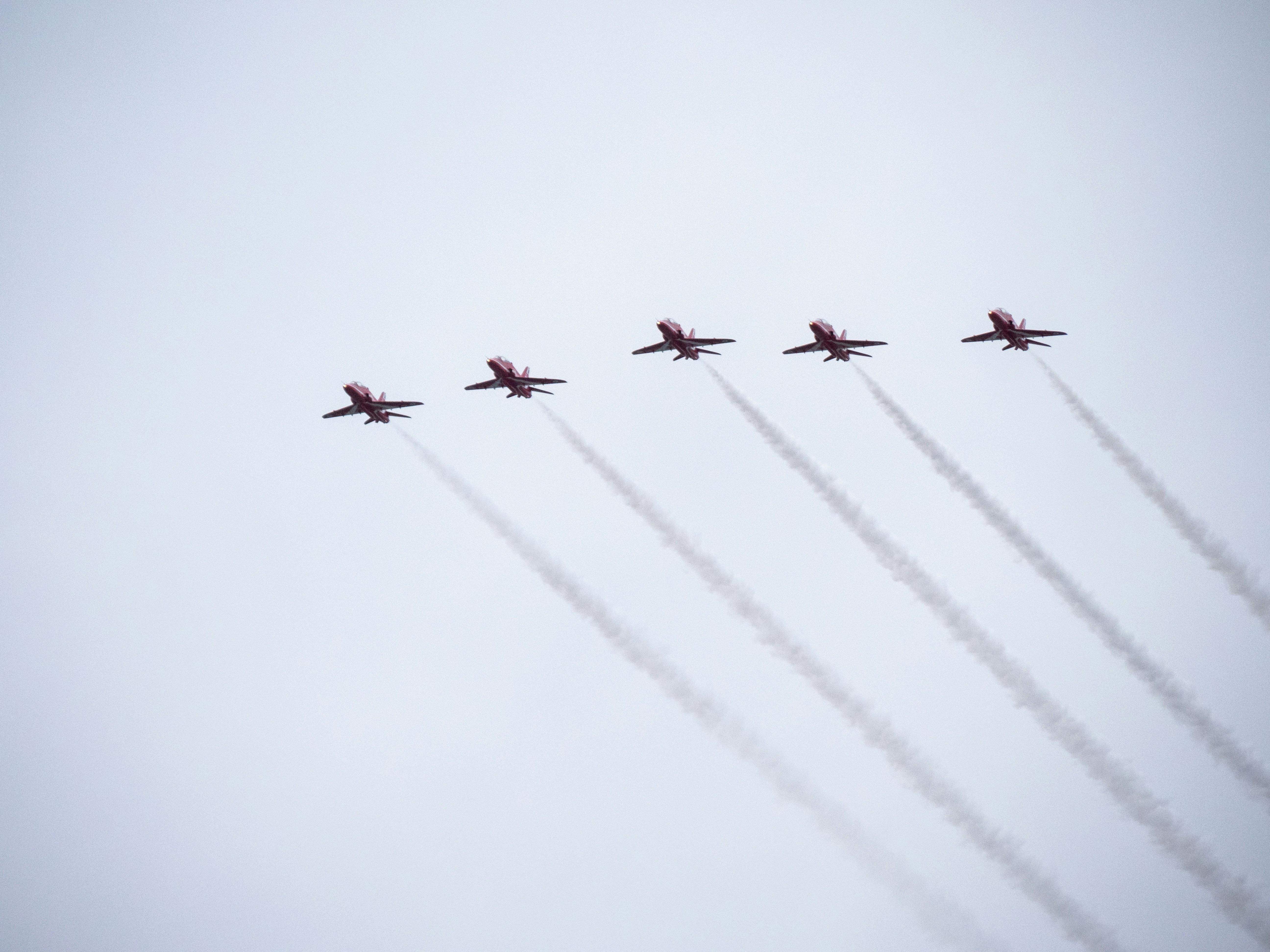 a group of airplanes flying in formation in the sky