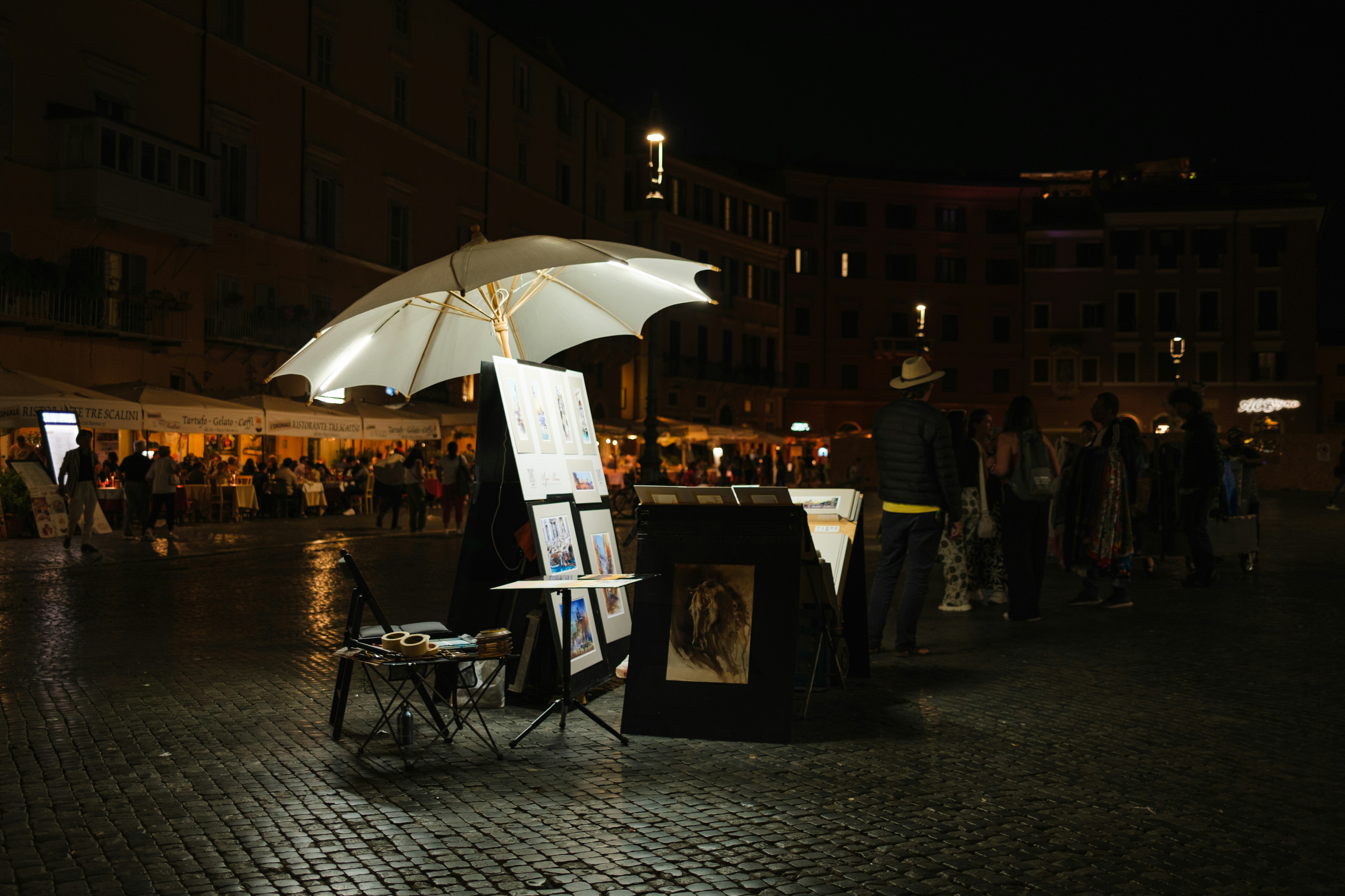 a white umbrella sitting on top of a table