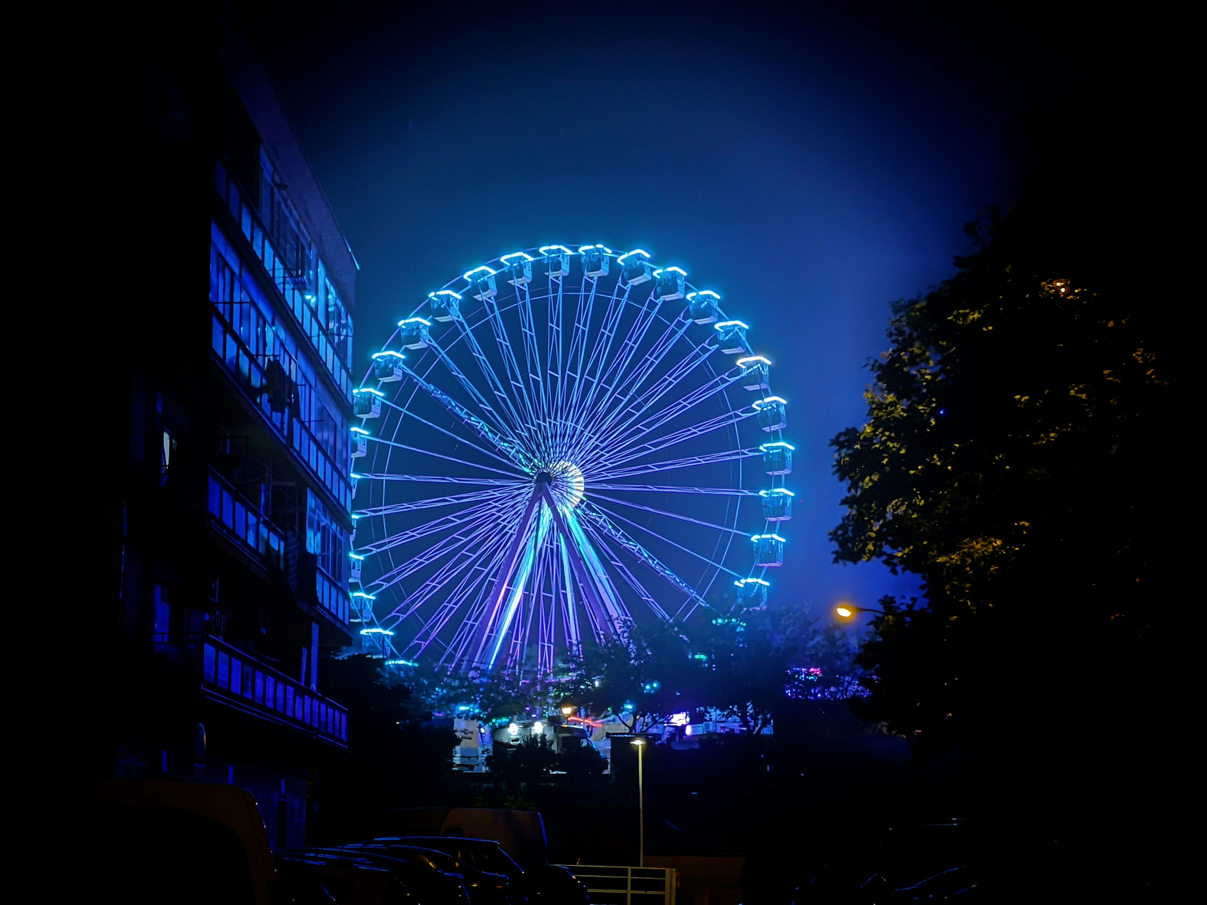 a large ferris wheel lit up at night