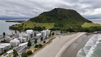 an aerial view of a city next to the ocean