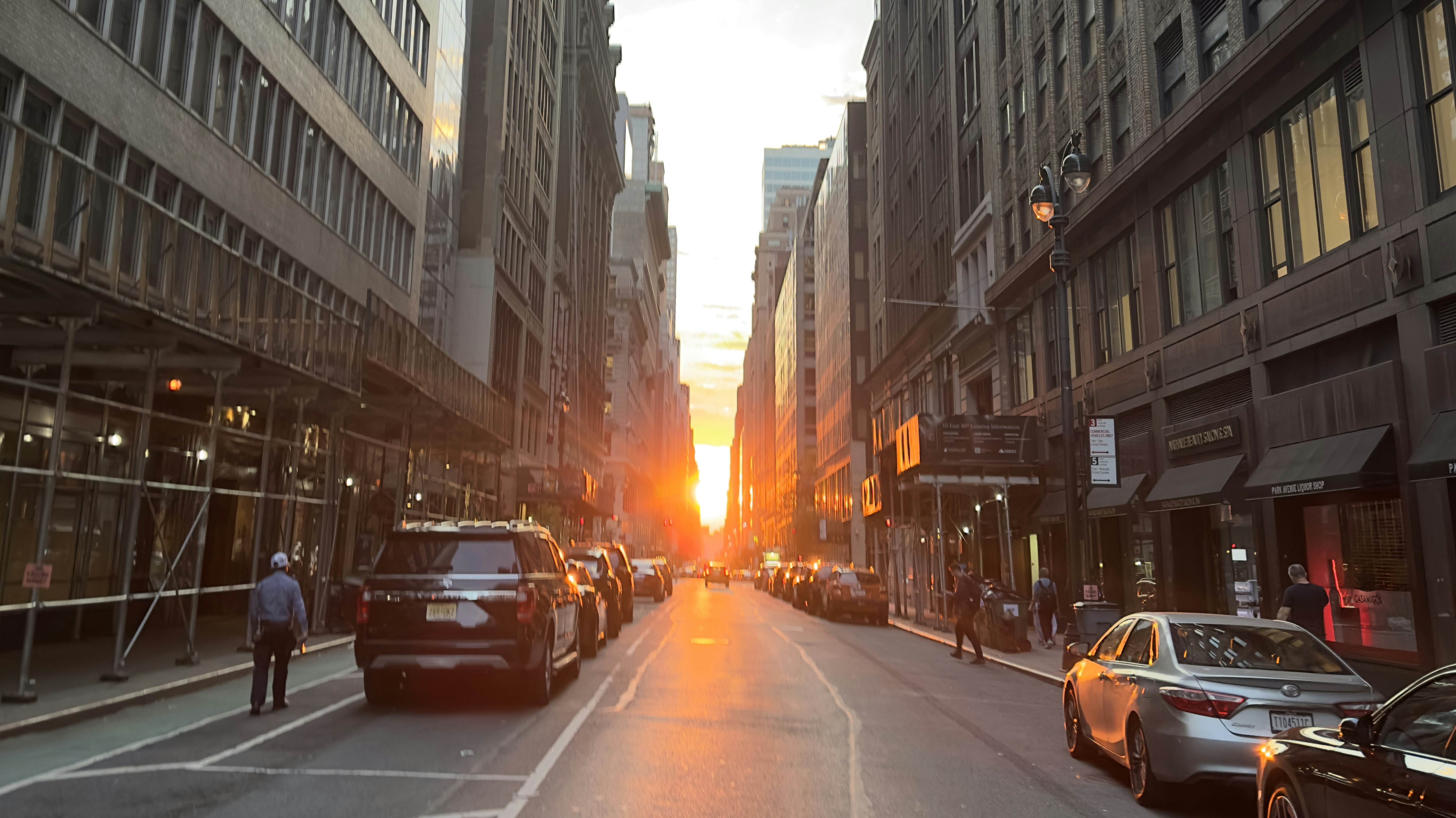 a city street filled with traffic and tall buildings