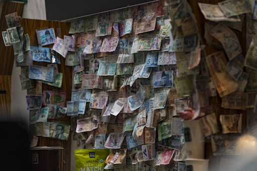 a bunch of money hanging on a wall