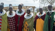 a group of women standing next to each other