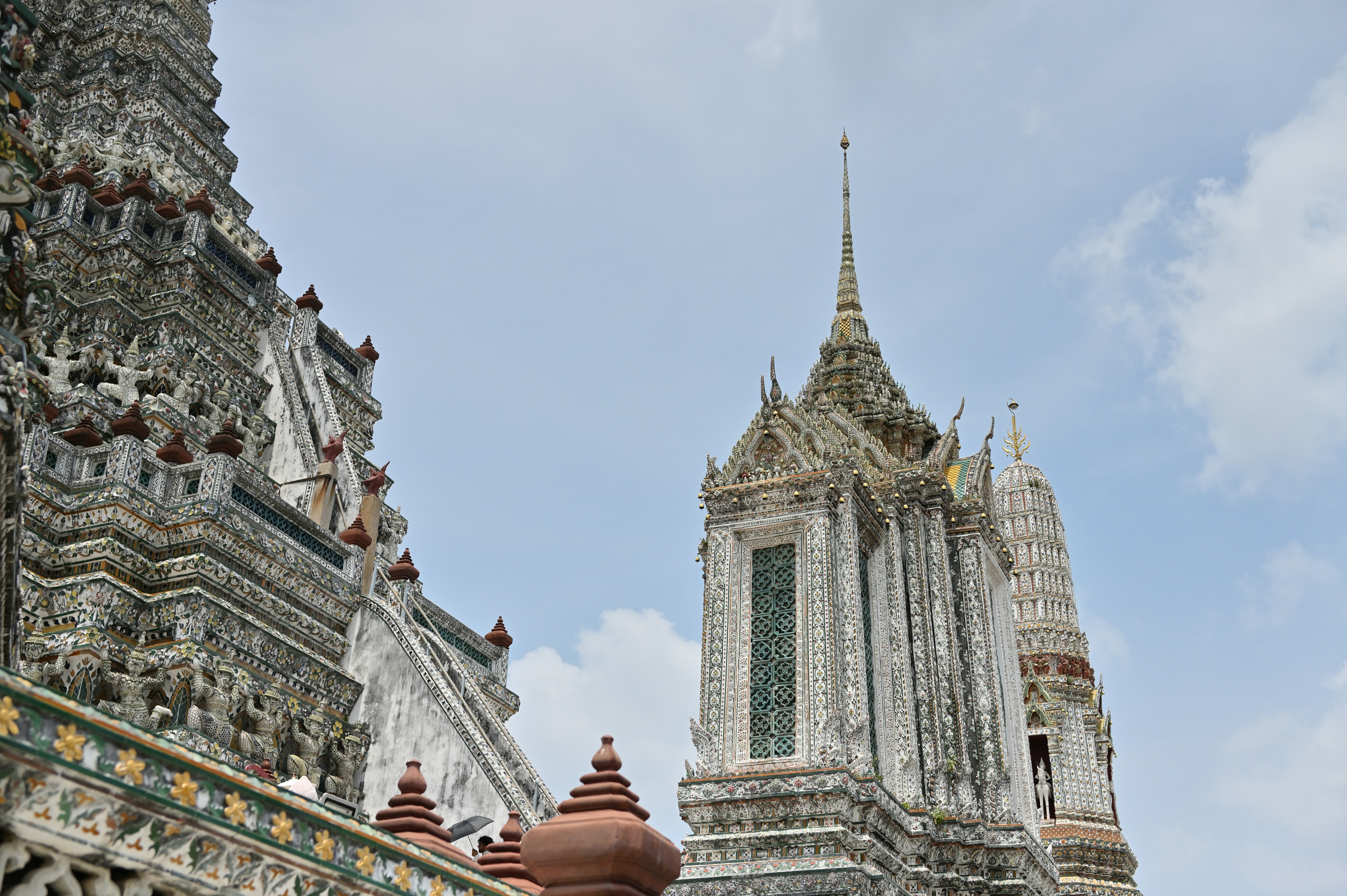 a very tall building with a clock on it's side