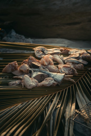 a pile of food sitting on top of a wooden table