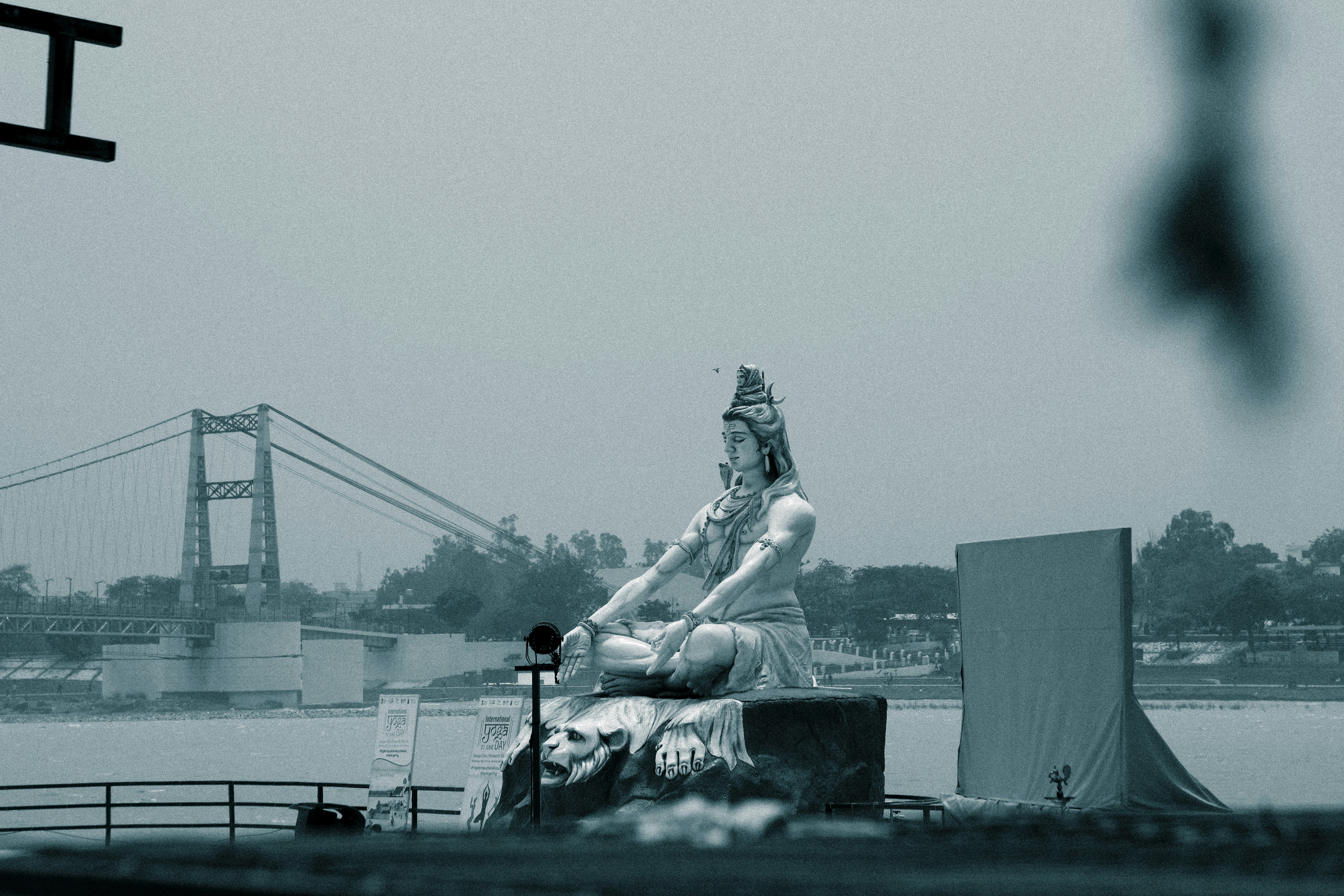 a statue of a woman sitting on top of a boat
