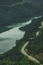 A scenic view of a river and a road