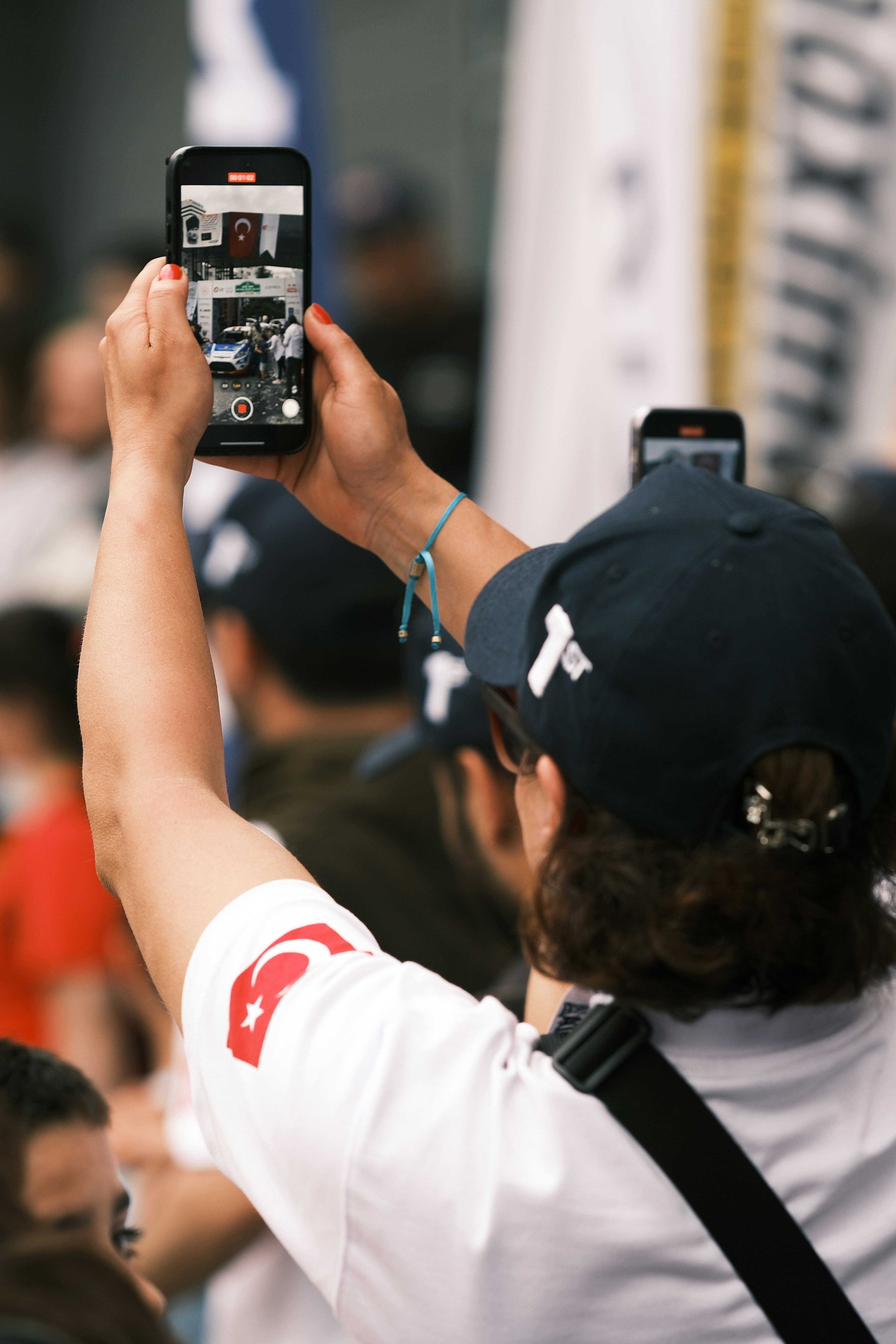 A person taking a picture with a cell phone