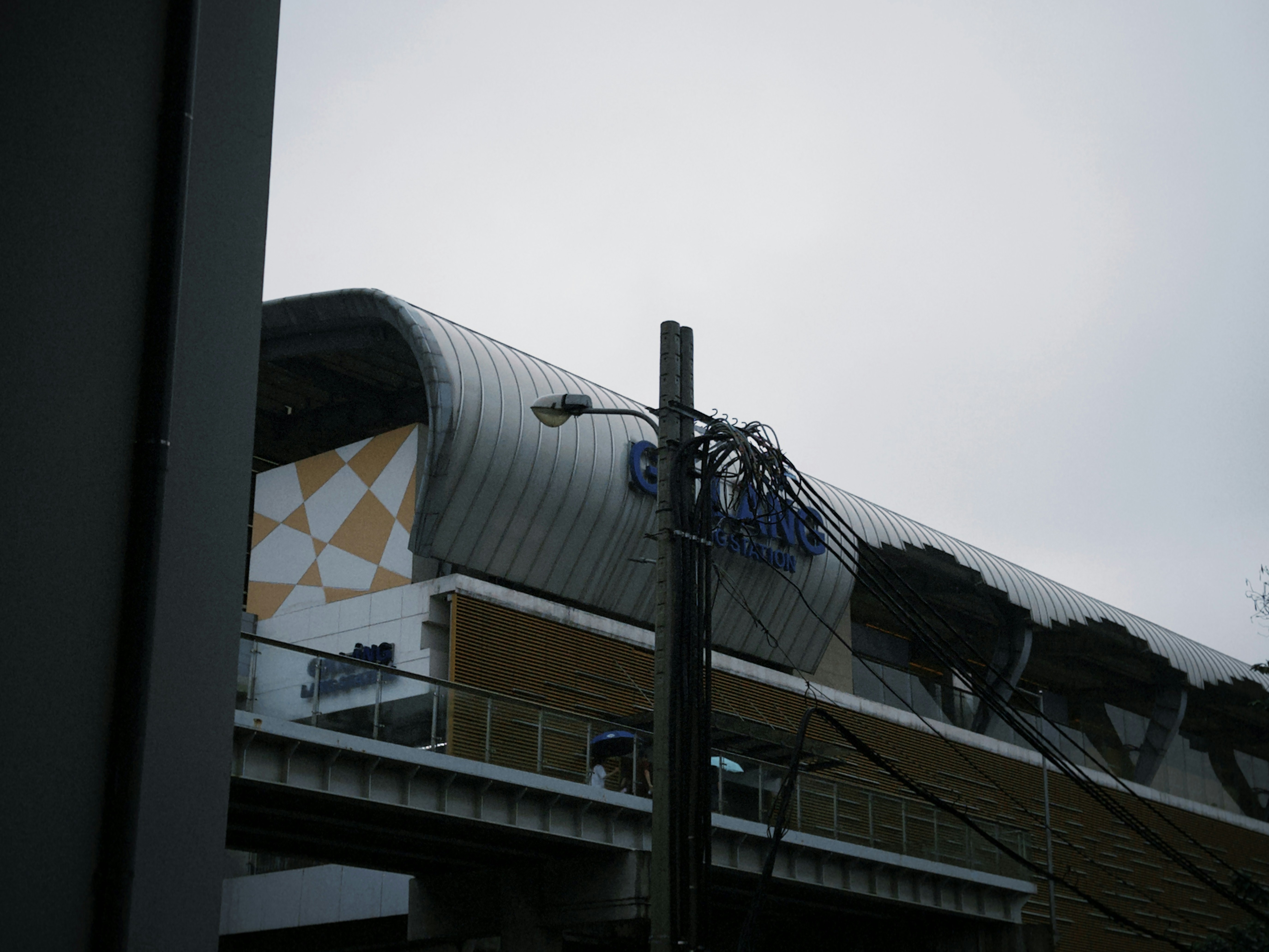 a tall building with a metal roof and a metal roof