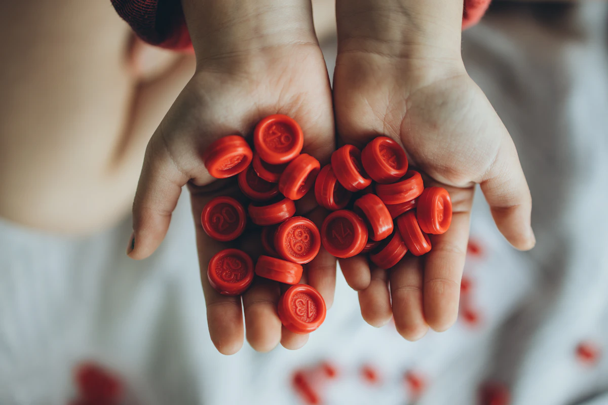 Child's hands full of small textured objects
