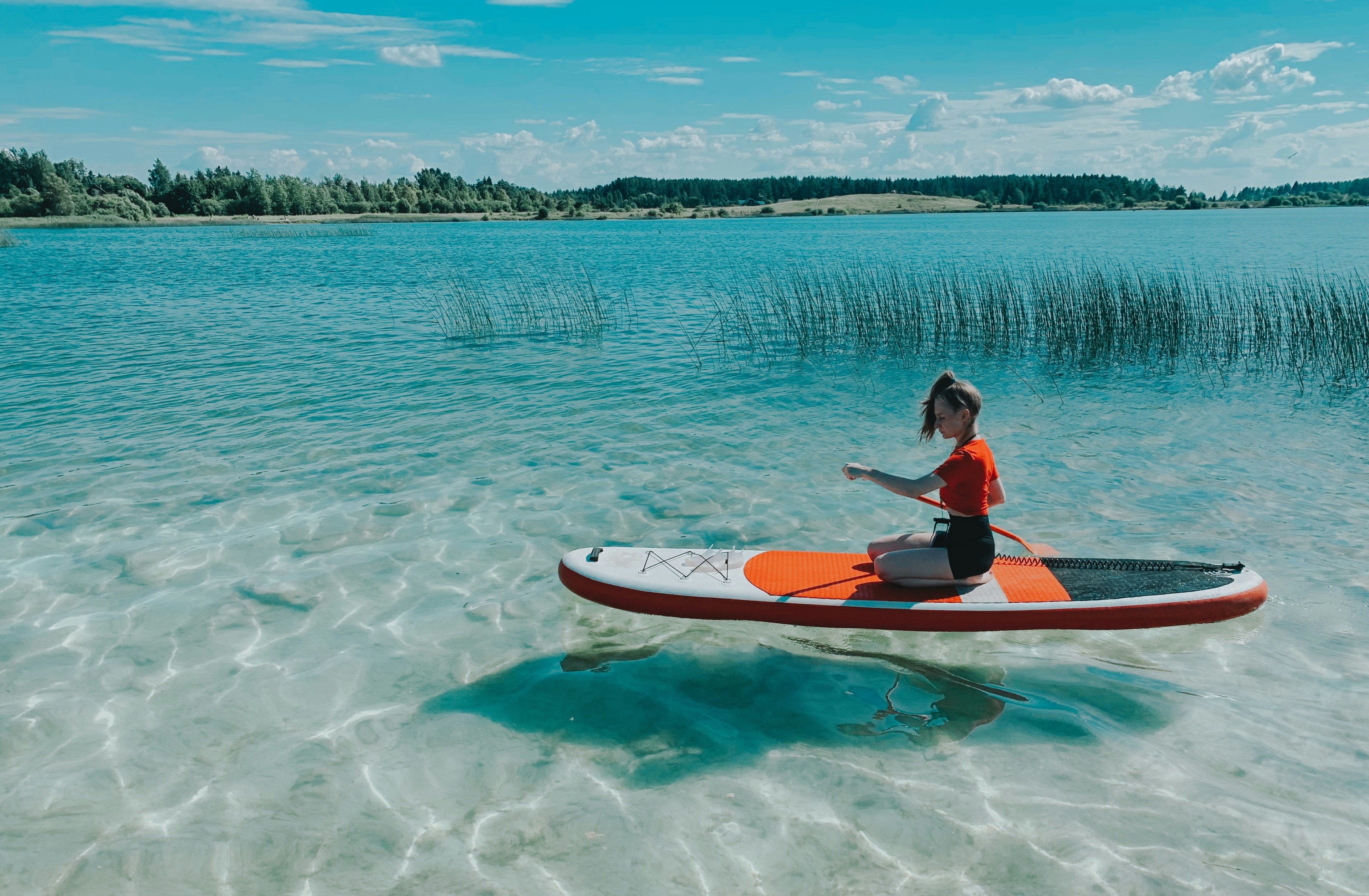A person on a small boat in a body of water