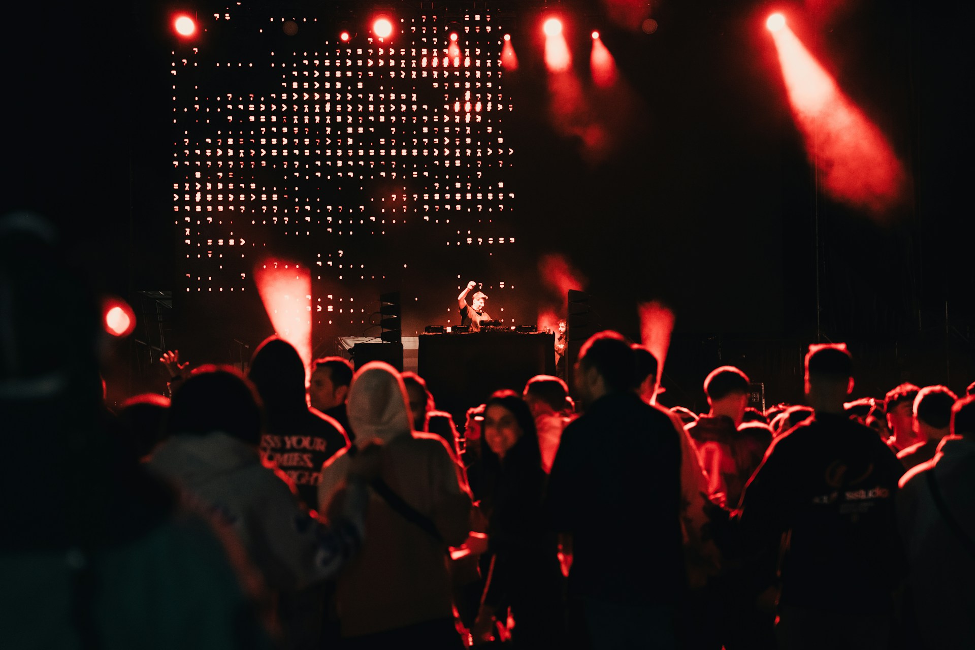 A crowd of people standing around a stage