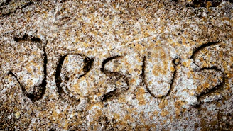 a close up of a rock with writing on it