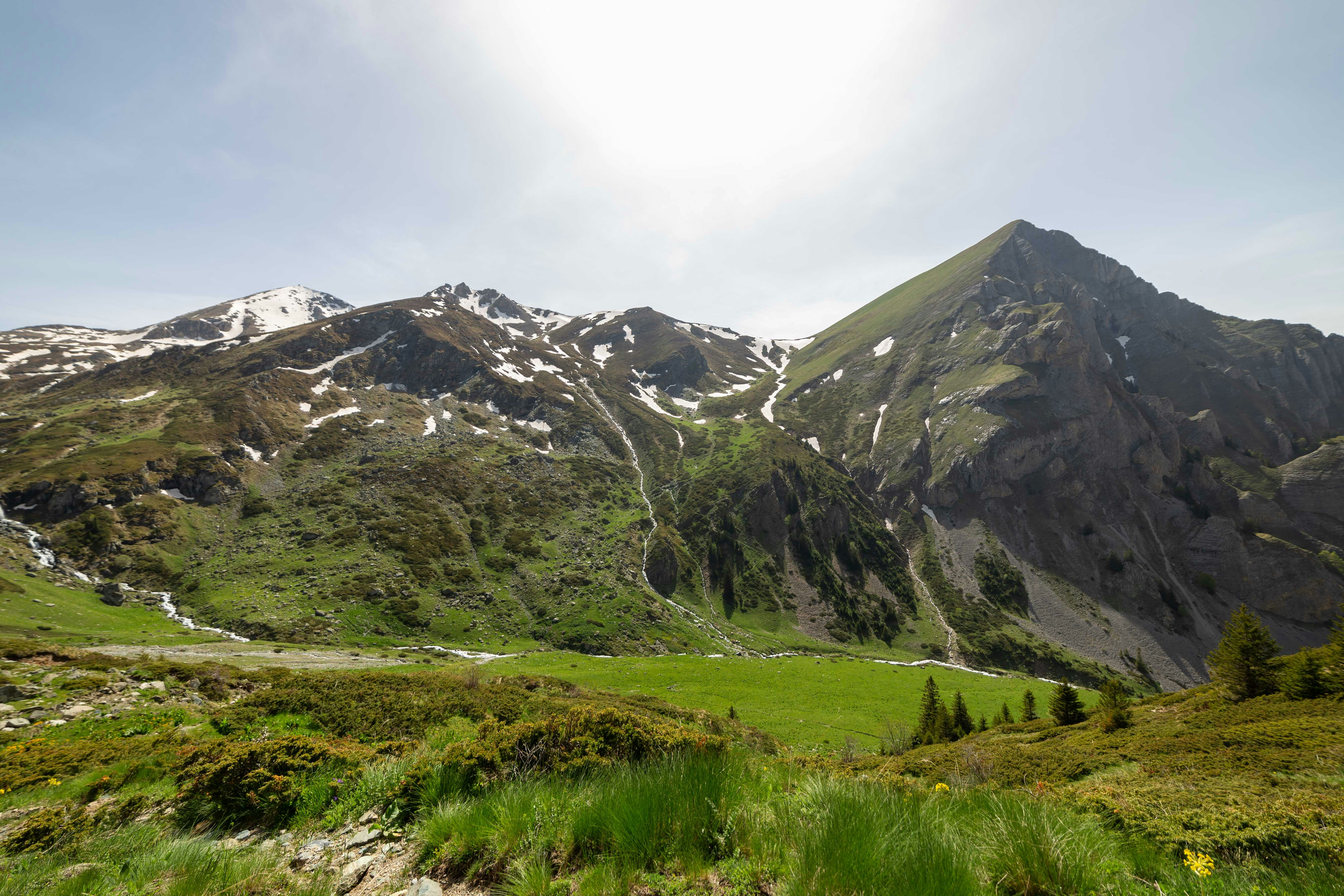 The sun shines on a mountain range