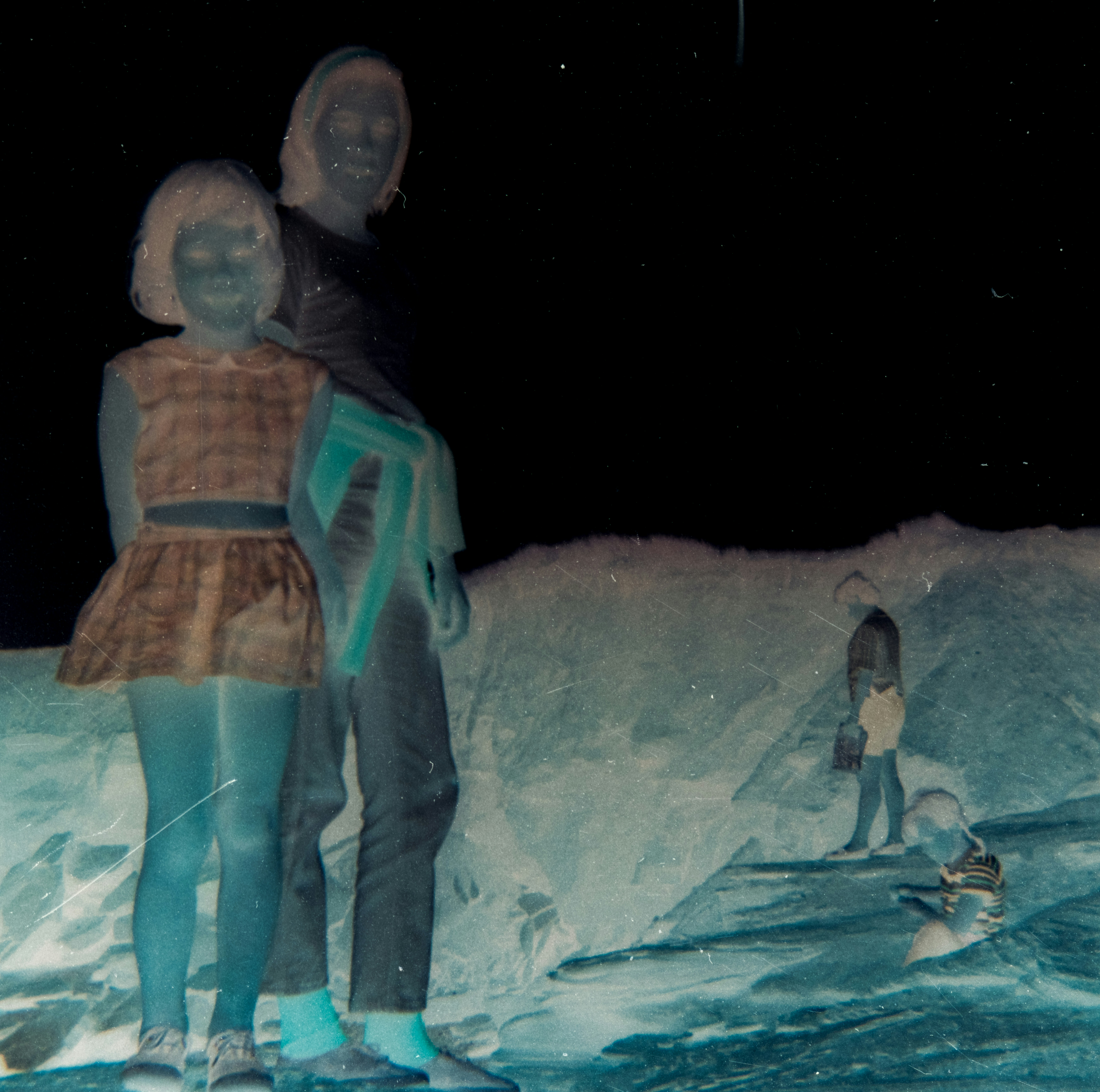 a couple of people that are standing in the snow