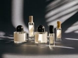 A group of perfume bottles sitting on top of a table