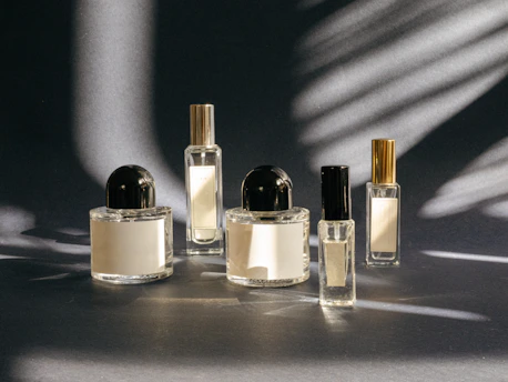 A group of perfume bottles sitting on top of a table