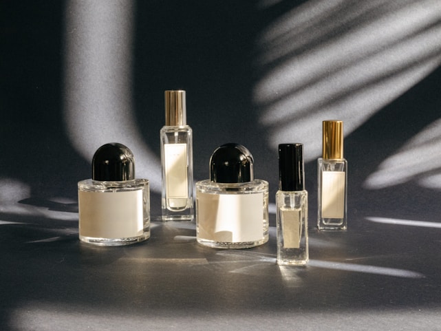 A group of perfume bottles sitting on top of a table