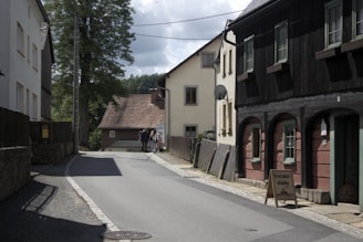 A narrow street with a few buildings on both sides