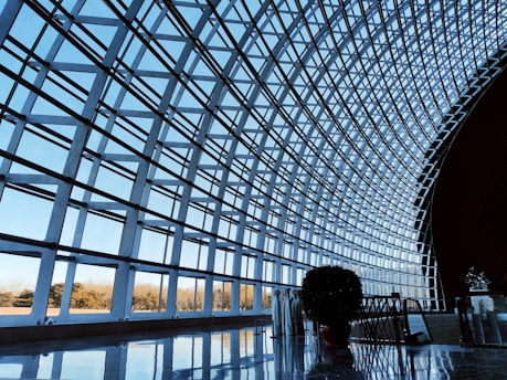 A person standing in front of a large metal structure