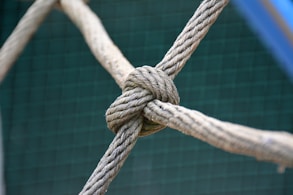 A close up of a knot on a fence
