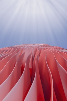 The sun shines brightly over a large red object