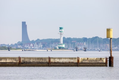 A large body of water with a tower in the background